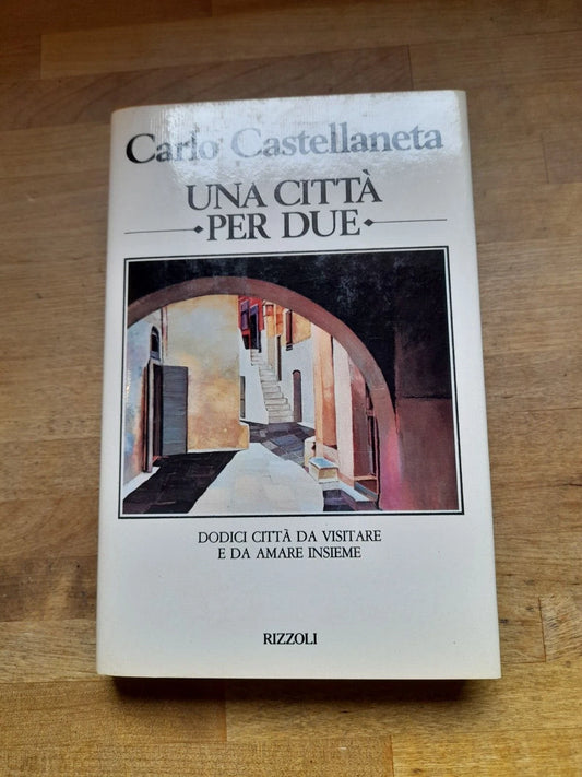 UNA CITTA' PER DUE. CARLO CASTELLANETA. RIZZOLI EDITORE. 1° EDIZIONE 1981. 12 CITTA' DA VISITARE  E DA AMARE INSIEME..