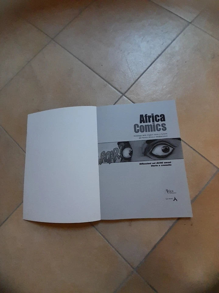 AFRICA COMICS. ANTOLOGIA DELLE MIGLIORI STORIE A FUMETTI DEL PREMIO AFRICA. AA.VV. LAI - MOMO 2002.